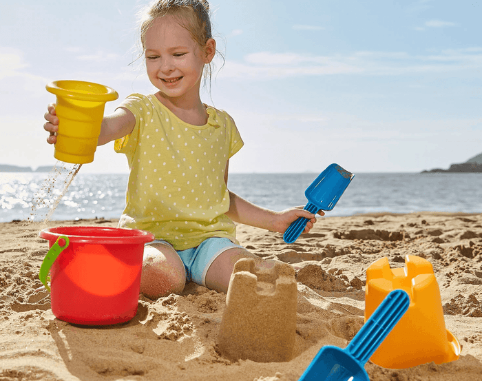 Ten Little Hape 5 in 1 beach set girl playing in the sand