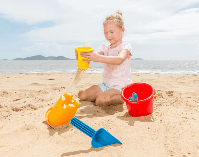 Ten Little Hape 5 in 1 beach set girl playing in the sand