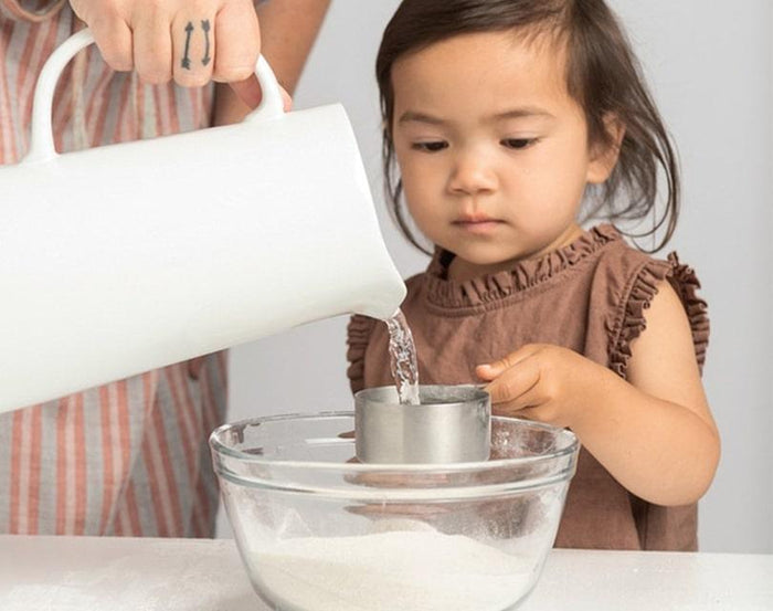 Girl making Eco-kids A Day at the Beach Kit sand casting medium