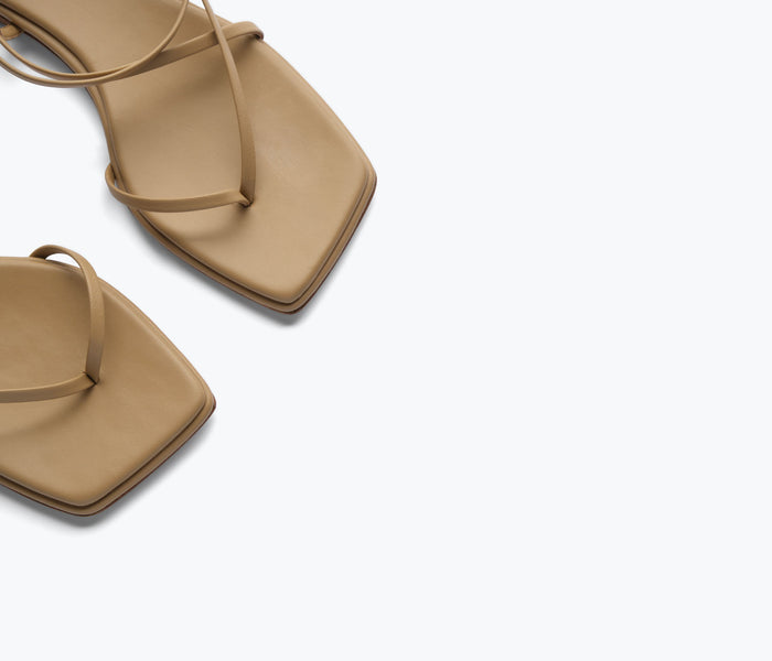 Freda Salvador Alexia sandal in latte color with detailed straps and open toe on a neutral background.
