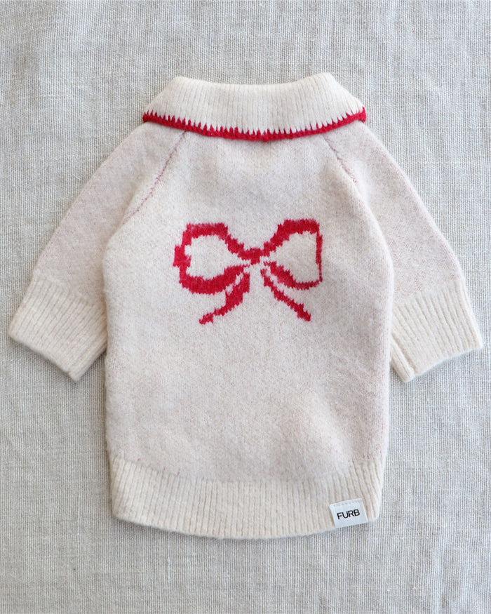 Festive ivory dog sweater with red bow detail and charming Peter Pan collar for small to medium breed dogs