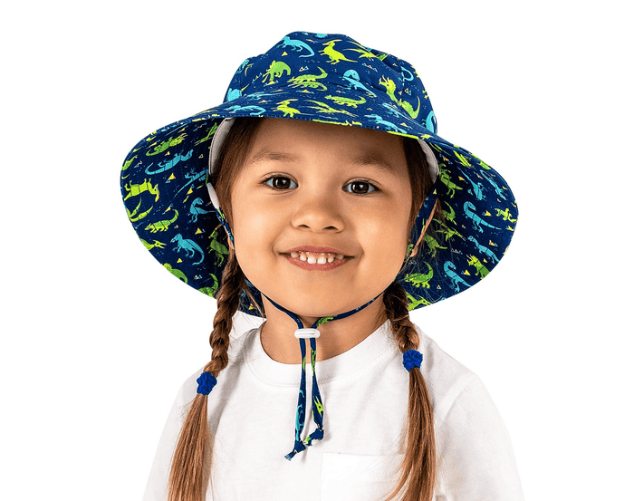 Child wearing Jan & Jul AquaDry Bucket Hat - Dino. Available at www.tenlittle.com