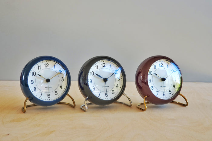 Classic Arne Jacobsen "AJ" Alarm Clock in blue, black or burgundy red AA batteries not included.