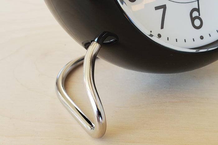 Classic Arne Jacobsen "AJ" Alarm Clock in blue, green or burgundy red AA batteries not included. detail