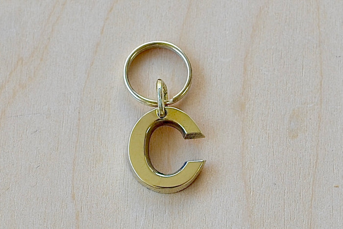 'C' Letter keyring, key chain, key ring in brass made by Carl Aubock.