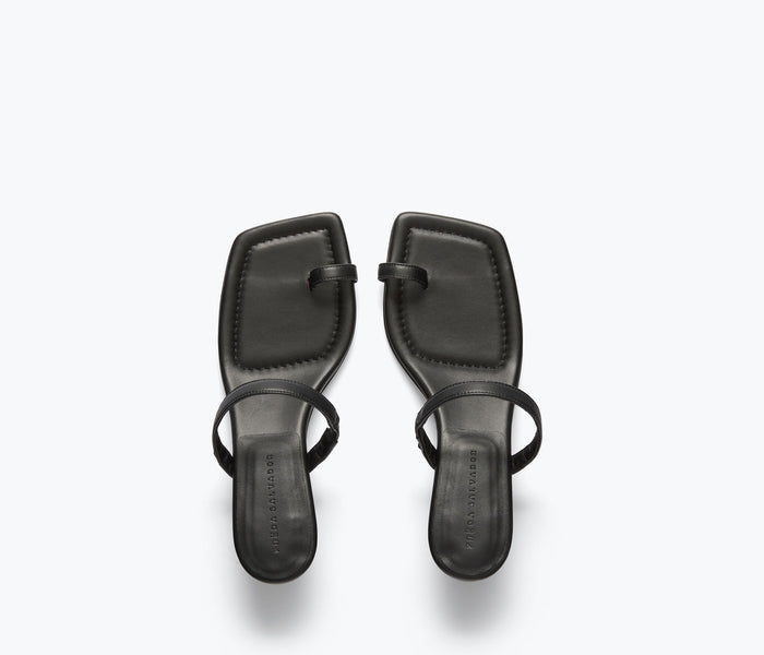 Black Freda Salvador Aurora heel sandal with calf leather strap and sleek design, shown from the top view.