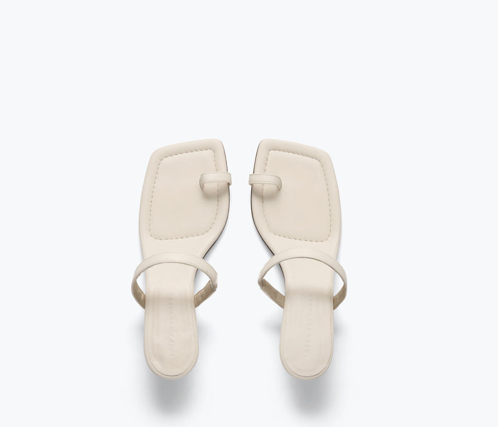 Freda Salvador Aurora heel sandal in macadamia color, featuring a stylish open-toe design and calf-top strap.