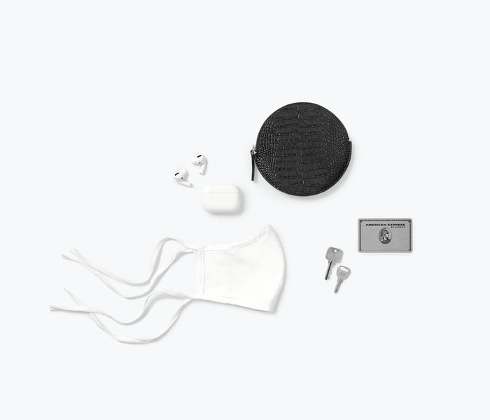 Freda Salvador AVA circle cardholder pouch with compact design and leather finish, featuring a zip closure and versatile style.