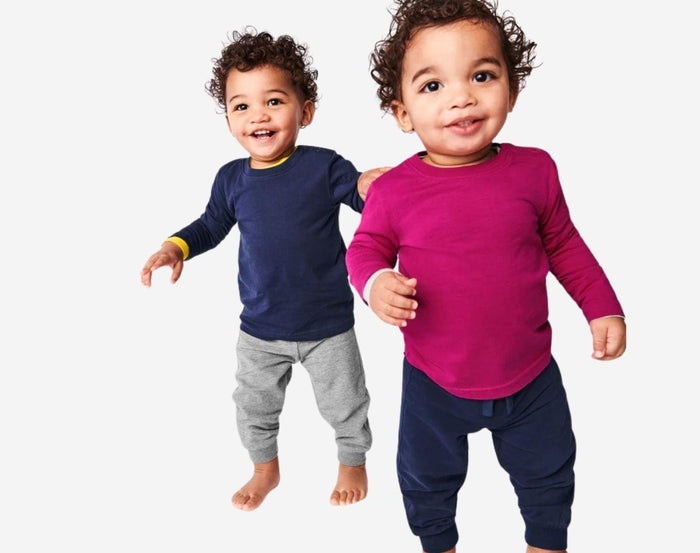 Babies wearing Primary Baby French Terry Jogger in Heather Gray and Navy. Available at www.tenlittle.com