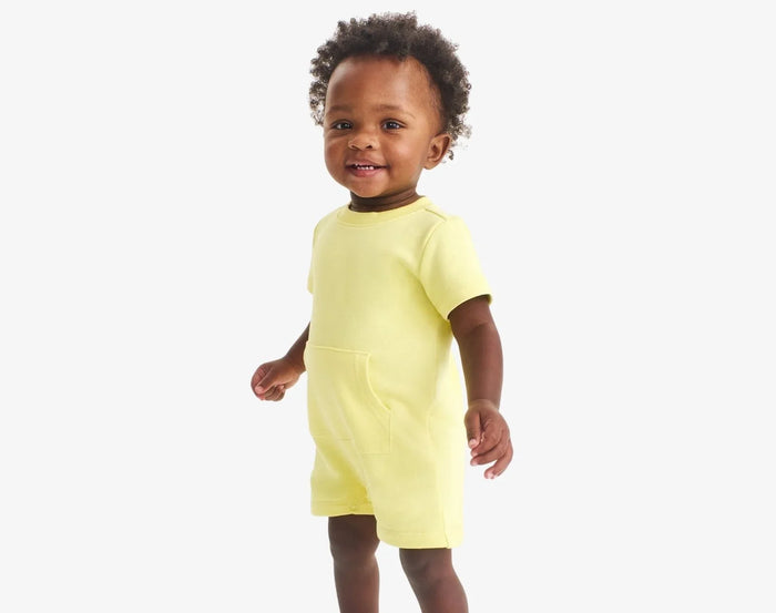 Baby wearing Primary Baby French Terry Romper - Buttercup. Available at www.tenlittle.com