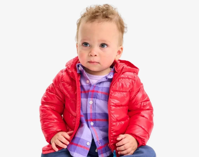 Baby sitting wearing Primary Baby Lightweight Puffer Jacket - Cherry. Available at www.tenlittle.com