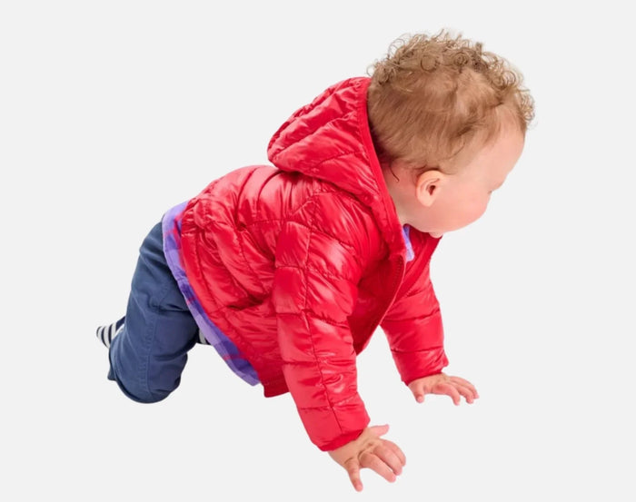 Baby crawling wearing Primary Baby Lightweight Puffer Jacket - Cherry. Available at www.tenlittle.com