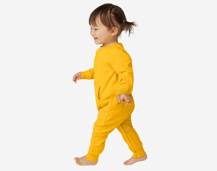 Girl wearing Primary - Baby Sweatshirt Romper - Sunflower - Available at www.tenlittle.com