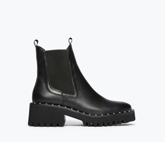 Black Bailey studded rain-resistant boot by Freda Salvador, front view showing studded detail and waterproof design.