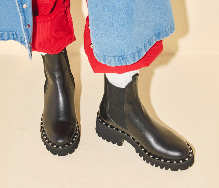 Freda Salvador Bailey studded rain-resistant boot in black leather with decorative studs, calf-length design, stylish and durable footwear.