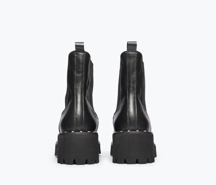 Black Bailey studded rain-resistant boot by Freda Salvador, back view showing calf height and studded detailing.