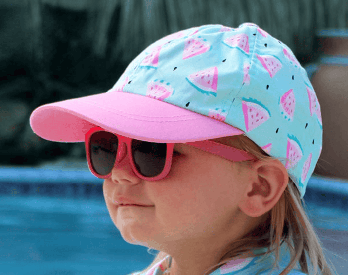 Girl wearing Jan & Jul Baseball Cap - Watermelon. Available at www.tenlittle.com