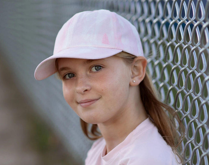 Girl wearing Jan & Jul Baseball Cap - Pink Tie Dye. Available at www.tenlittle.com