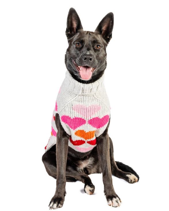 Cozy red Valentine's sweater for dogs with white heart pattern.