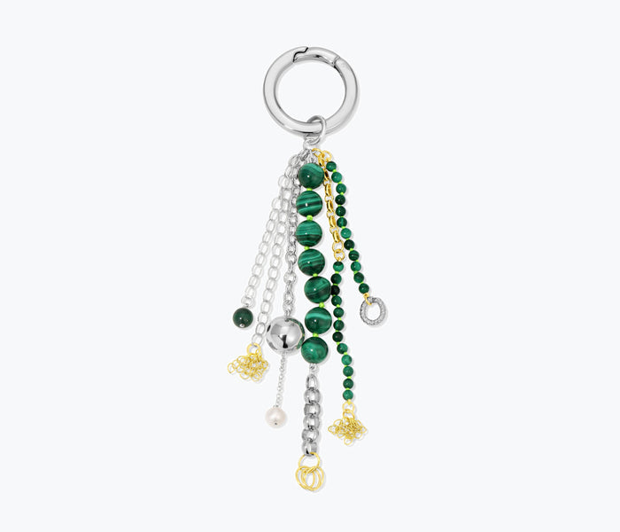 Colorful beaded bag charm accessory by Monbouquette featuring intricate beadwork and a decorative tassel.