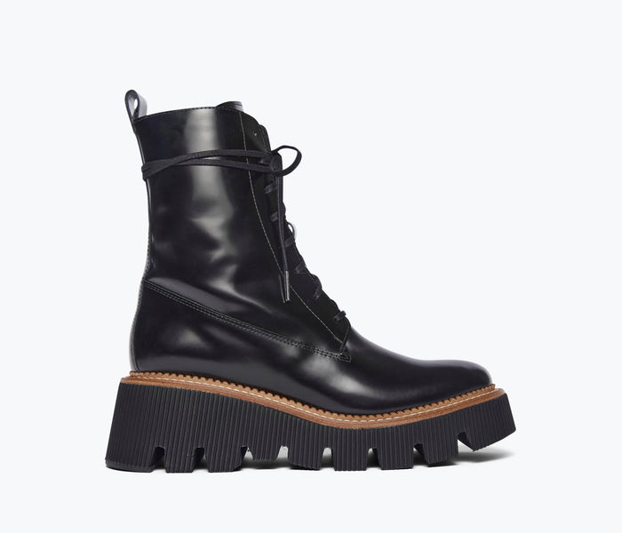 Black FREDA SALVADOR Billie platform combat boot with front view showing lace-up design and chunky sole.