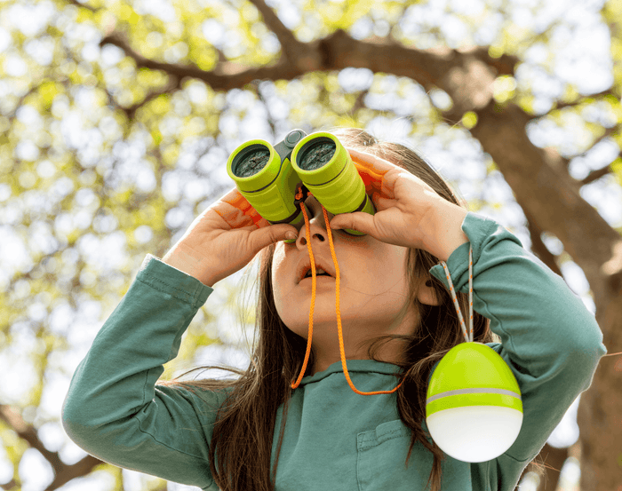 Child looking through HABA Binoculars. Available at www.tenlittle.com