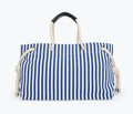 Navy and white canvas Birdie handbag by Freda Salvador with front view showing tote style and natural canvas texture.