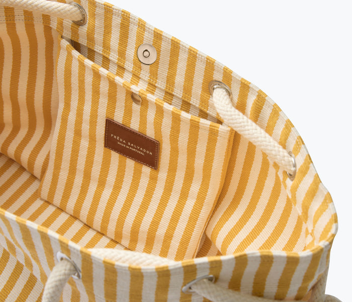 Mustard and white canvas Birdie handbag by Freda Salvador, showing the interior of the stylish tote bag.