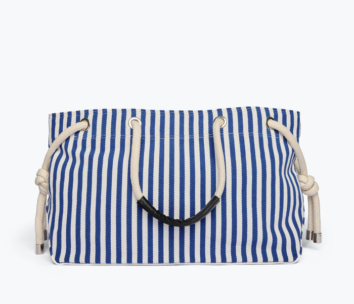 Navy and white canvas Birdie tote handbag by Freda Salvador with front view showing spacious design and sturdy handles.
