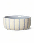 Blue and ivory ceramic dog bowl with modern minimalist feeding design. Updated May 2026.