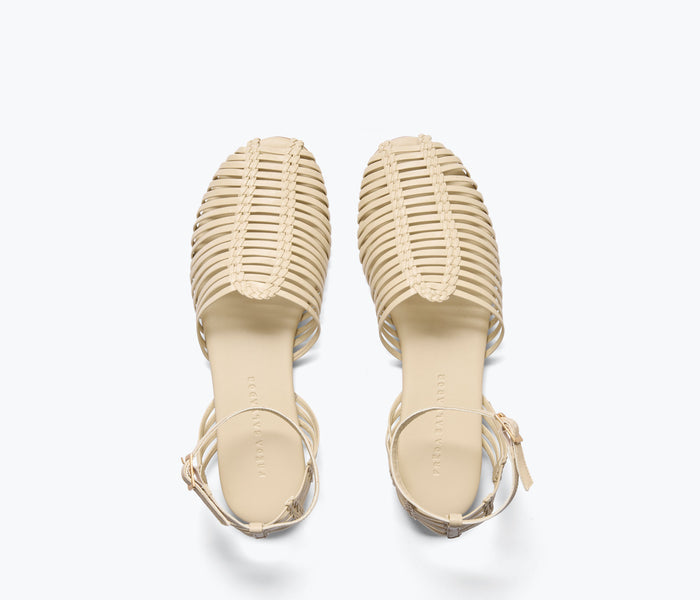 FREDA SALVADOR Blake Caged Woven Flat in vanilla calf leather with intricate woven strap design, flat sole, and open toe style.