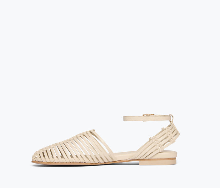 Freda Salvador Blake caged woven flat shoe in vanilla calf leather, showing the inside view of the stylish, handcrafted footwear.