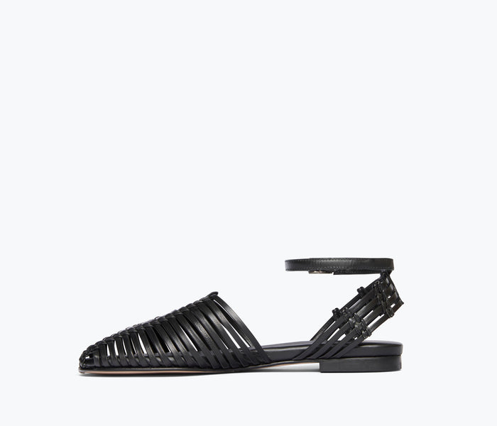 Black Freda Salvador Blake Caged Woven Flat shoe shown from inside angle on a plain background.