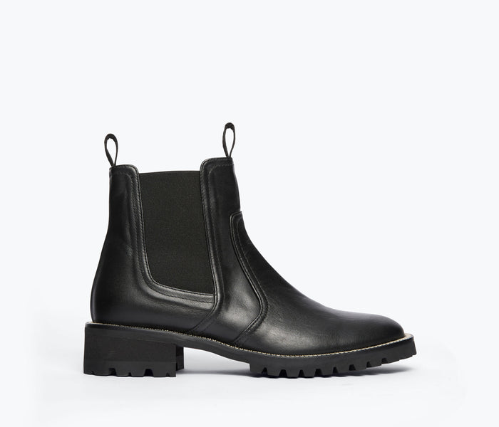 Black Bonnie Rain Resistant Boot by Freda Salvador shown from the front, featuring sleek design and waterproof material.