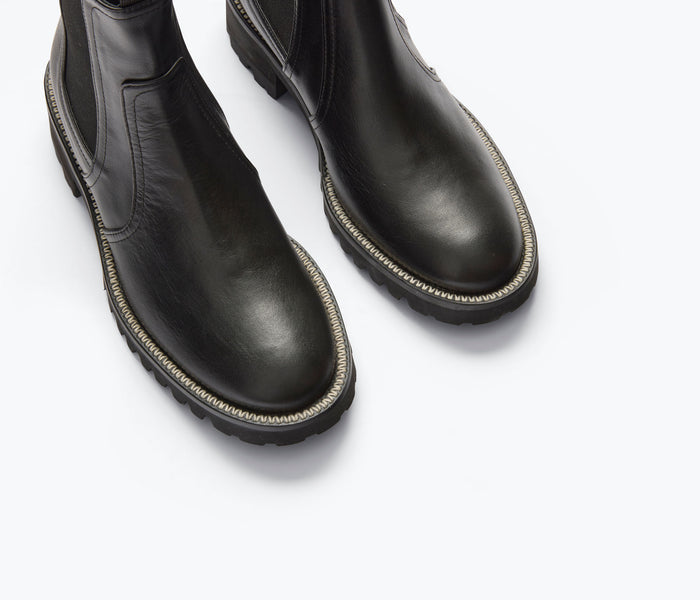 Freda Salvador Bonnie rain-resistant black boot with sleek design, showcasing smooth leather and sturdy sole.