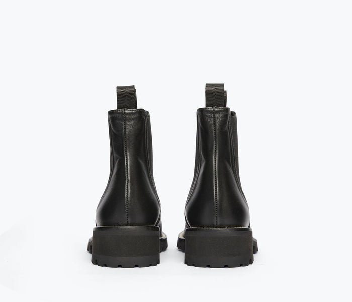 Freda Salvador Bonnie rain-resistant black boot with a heel, showcasing sleek design and durable waterproof material.