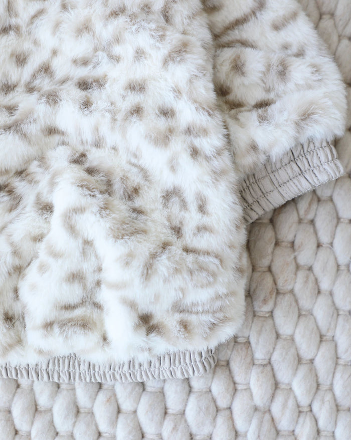 Cozy faux fur dog jacket designed for cold days and evening walks, ideal for beagles, spaniels, and mixed breeds
