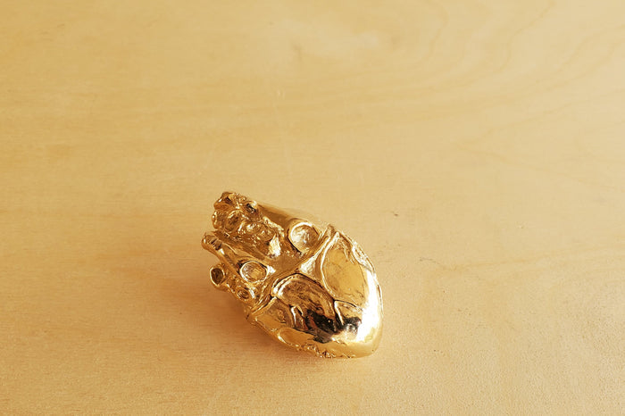 Bronze Object "Heart of Gold" by Anne Ricketts.