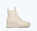 Cream Freda Salvador Brooke rain-resistant boot with a sleek front view, showcasing its stylish design and waterproof material.