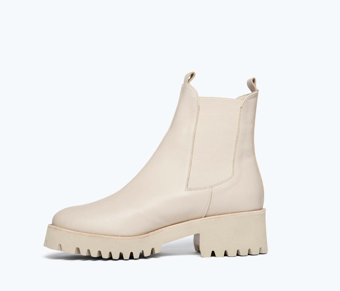 Freda Salvador Brooke rain-resistant boot in cream, showcasing the stylish exterior and comfortable interior lining.
