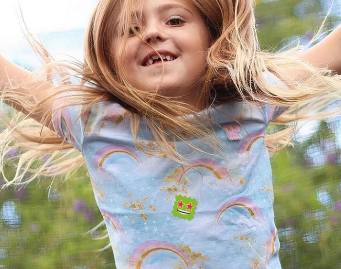 Child utilizing the NATPAT BuzzPatch Mosquito Repellent - 24 Patches on t-shirt. Available from www.tenlittle.com