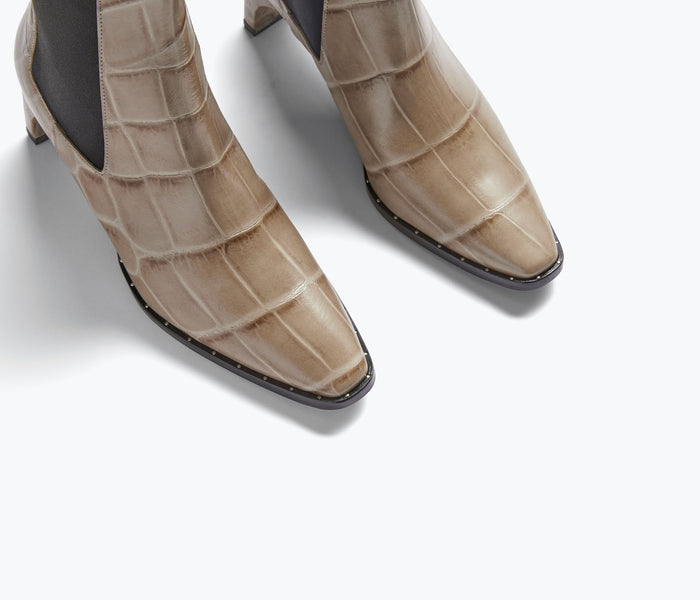 Freda Salvador Callie Chelsea boot with stone crock detail, showcasing sleek leather design and elastic side panels.