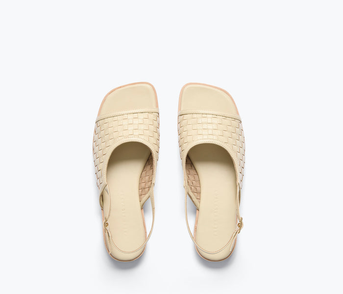 Freda Salvador Carmen slingback sandal with woven vanilla-colored top and sleek design on a neutral background.