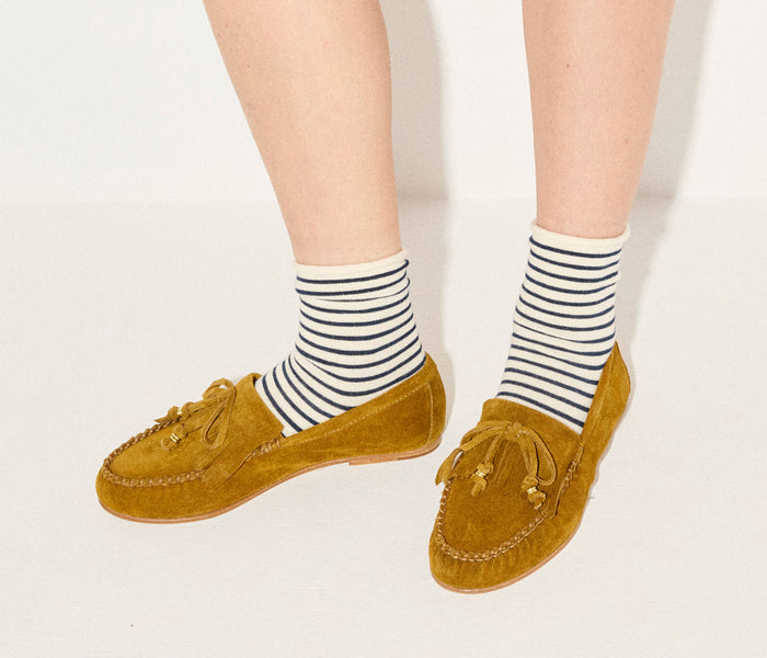 Fredas Salvador Celeste Fringe Loafer in beige suede with fringe detailing and classic slip-on style.
