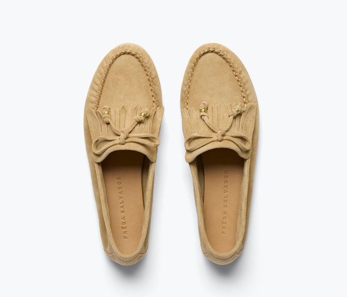 Celeste fringe loafer by Freda Salvador in stucco suede with decorative fringe detail and classic slip-on style.