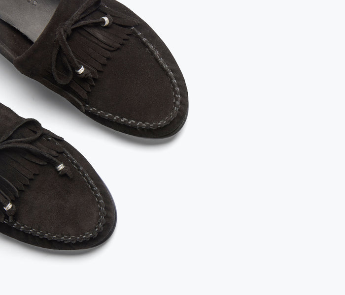 Black suede CELESTE FRINGE loafer by FREDA SALVADOR with fringe details and classic loafer design.