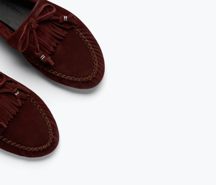 Fredas Salvador Celeste Bordeaux suede fringe loafer showing detailed side view with fringe accents and smooth suede texture.