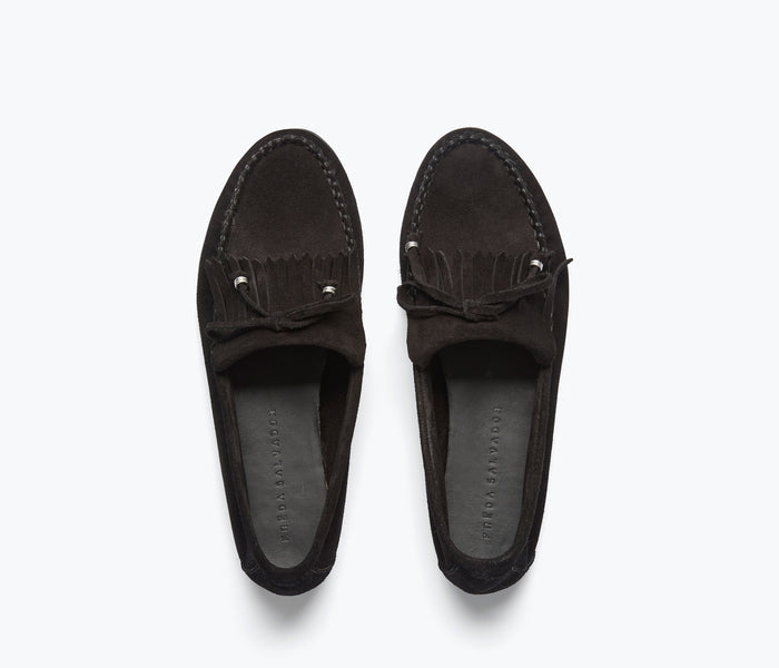 Black suede Celeste Fringe Loafer by Freda Salvador with decorative fringe detail and sleek slip-on design.