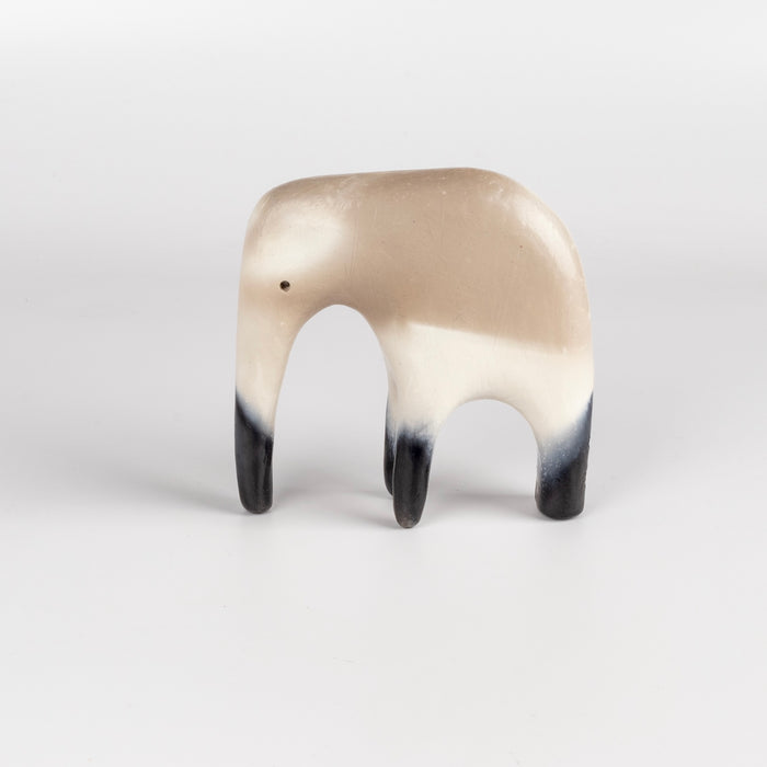 Formed from solid clay and refined by hand, this "one of a kind" ceramic creature is made out of white earthenware and white terra sigillata before getting pit fired in the wilderness. Made by Carol Horst in Los Angeles.