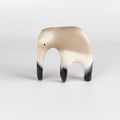 Formed from solid clay and refined by hand, this "one of a kind" ceramic creature is made out of white earthenware and white terra sigillata before getting pit fired in the wilderness. Made by Carol Horst in Los Angeles.